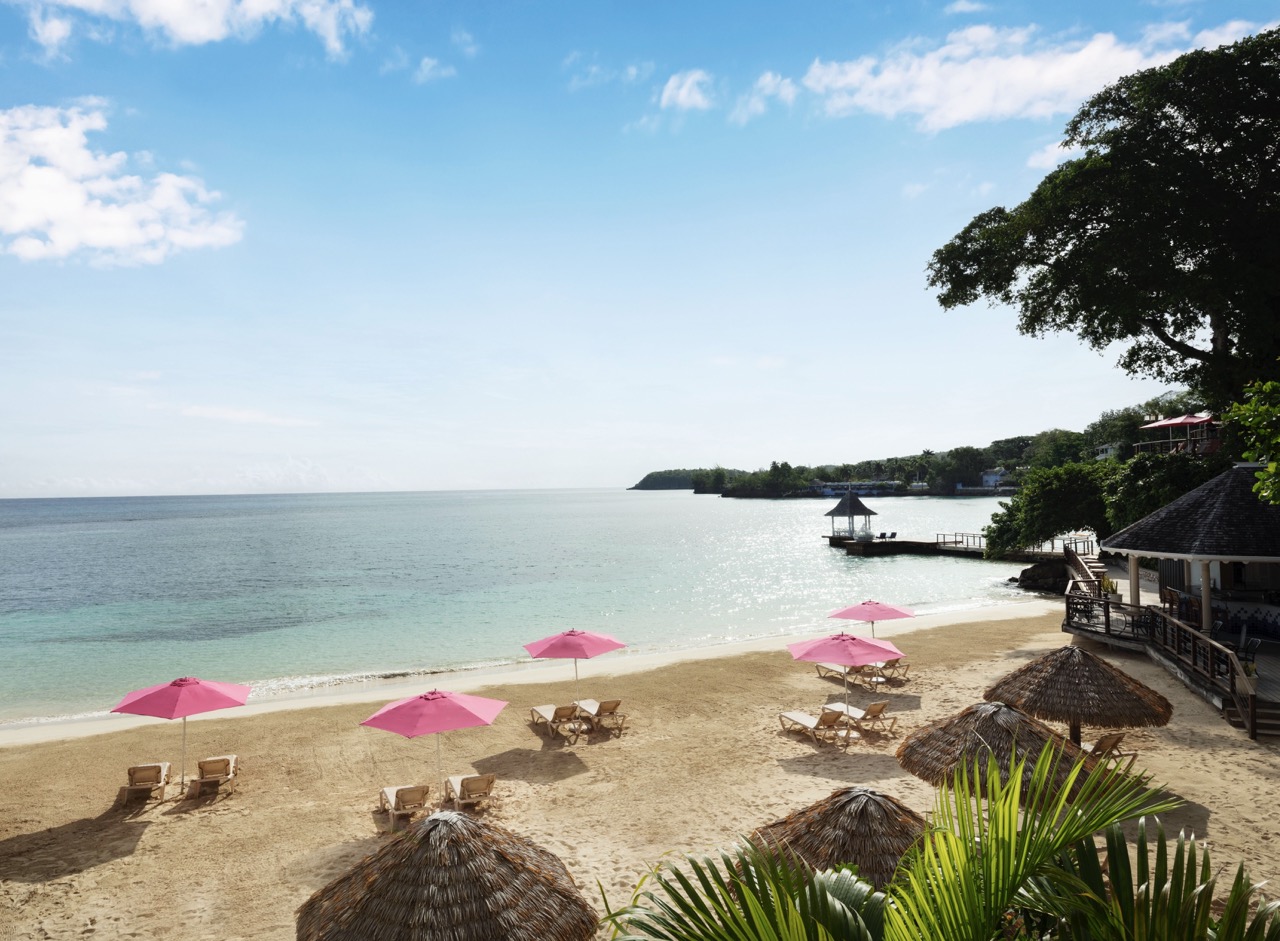 Sandals Royal Plantation beach with pink umbrellas